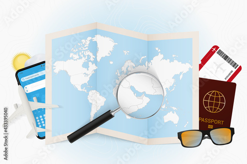 Travel destination United Arab Emirates, tourism mockup with travel equipment and world map with magnifying glass on a United Arab Emirates.