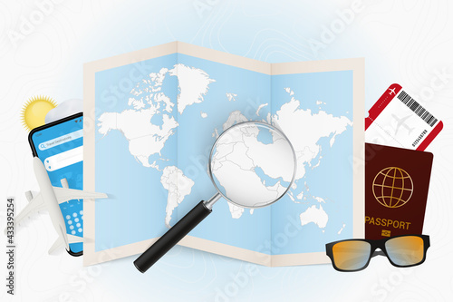 Travel destination Kuwait, tourism mockup with travel equipment and world map with magnifying glass on a Kuwait.