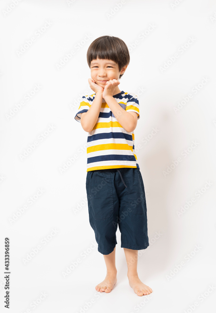Happy Asian child boy standing over white background. Happy Asian child boy standing over white background.