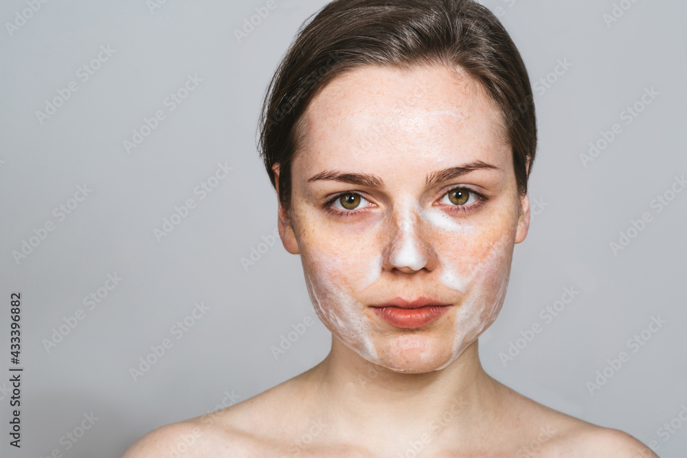 Naklejka premium Woman soap face clean skin beauty spa skin care female portrait close up
