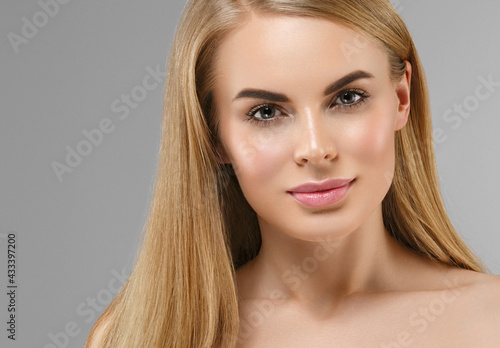 Beautiful blonde hair woman with healthy beauty skin studio female portrait