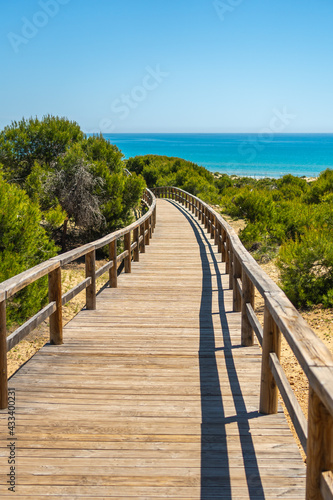 Wooden path to Playa Moncayo in Guardamar del Segura next to Torrevieja, Alicante. Community of Valencia. Spain