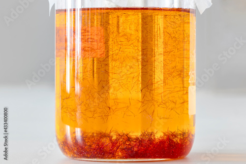 фотографія The process of crystallization began on the bottom and on the inner surface of the beaker