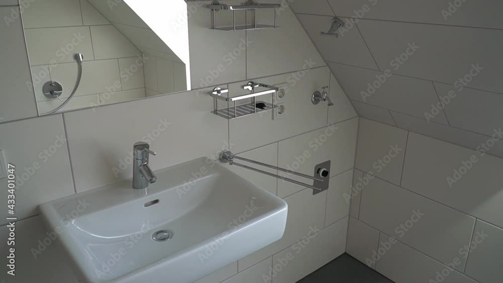 Small bathroom with mirror and sink. Real estate video showing a bathroom. Small bathroom with mirror and sink. Real estate video showing a bathroom.