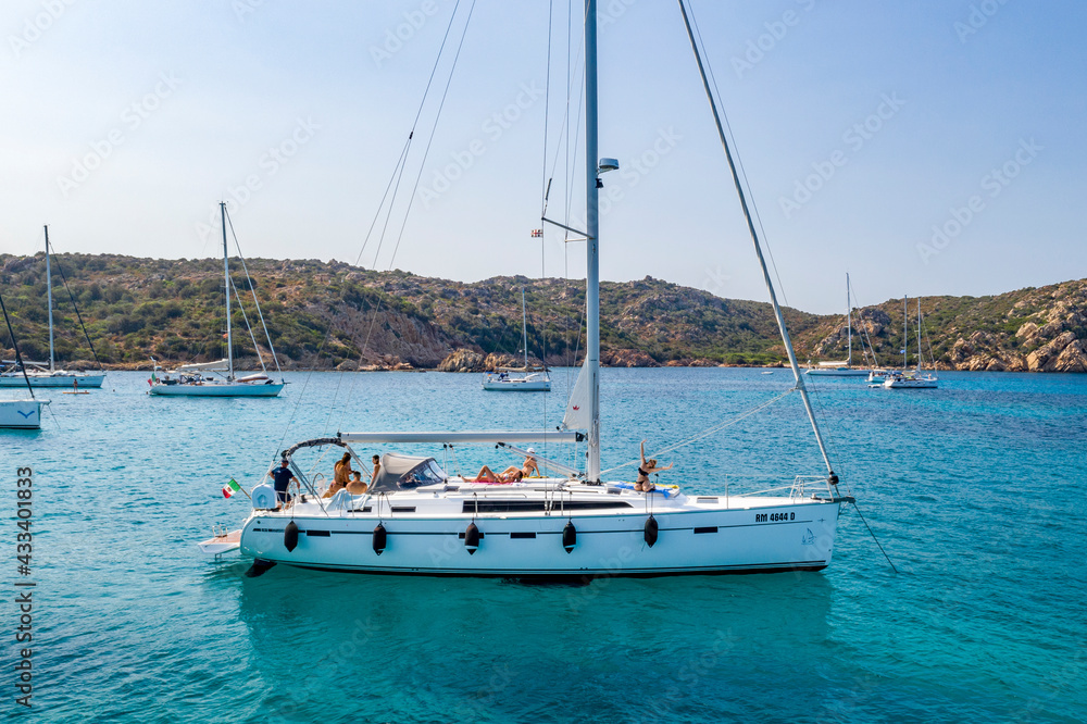 view of a sailboat with girls view of a sailboat with girls
