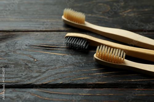 Eco friendly toothbrushes on rustic wooden background