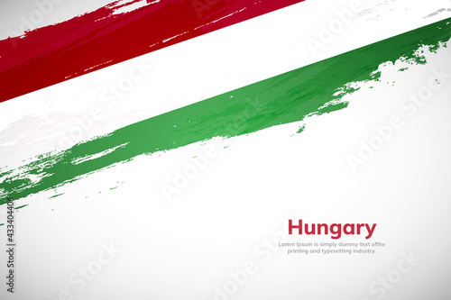 Brush painted grunge flag of Hungary country. Hand drawn flag style of Hungary. Creative brush stroke concept background photo