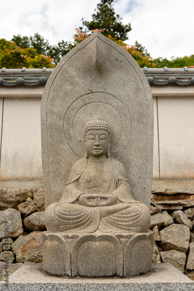Obraz premium Stone statue of Amitabha Tathagata at Taifuku-ji temple in Kobe, Hyogo, Japan