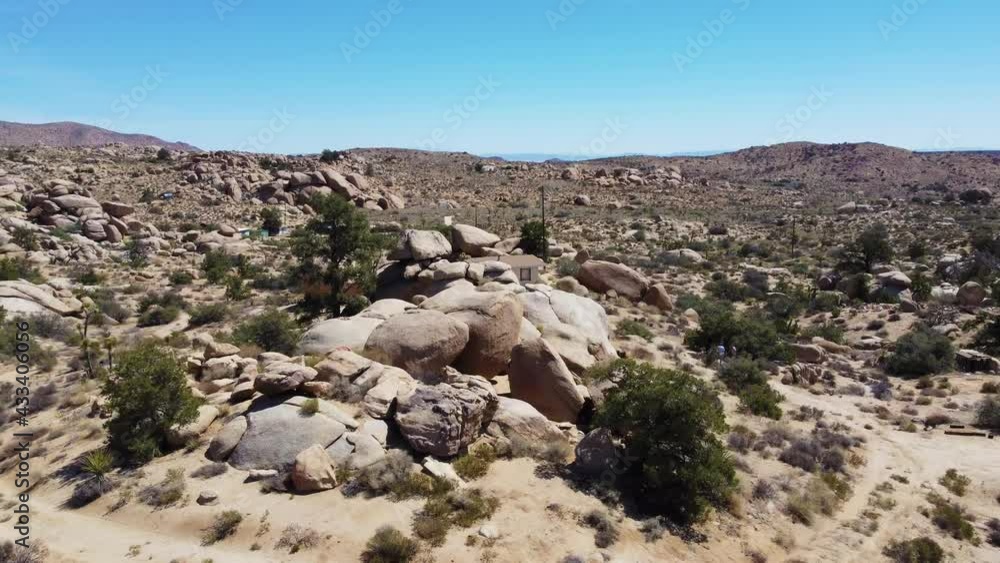 Small houses in middle of vast desert in drone reveal view Small houses in middle of vast desert in drone reveal view