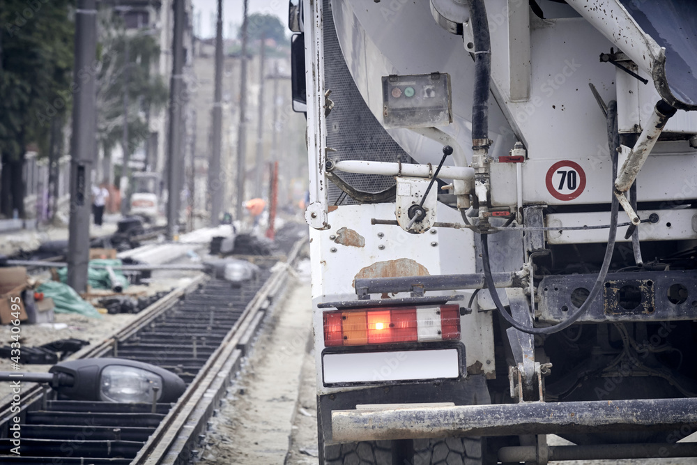 Naklejka premium Heavy construction truck outdoors for public place reconstruction.