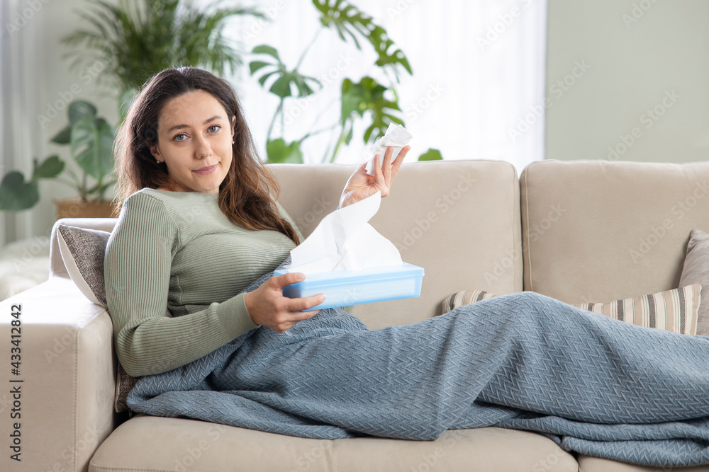 Young woman suffering from cold. Young woman suffering from cold.