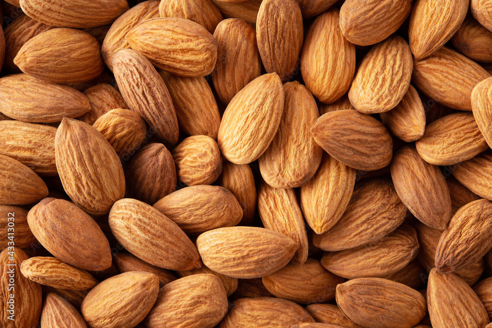 Almonds. Almond background. Almonds top view background. Whole nuts flat lay. Full depth of field. Almonds. Almond background. Almonds top view background. Whole nuts flat lay. Full depth of field.