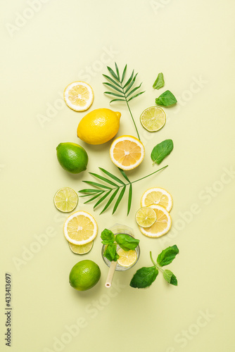 Summer pastel green citrus background. Slices of lemon lime and mint. Top view, copy space