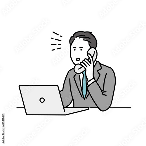 テキパキと電話をする男性ビジネスパーソン