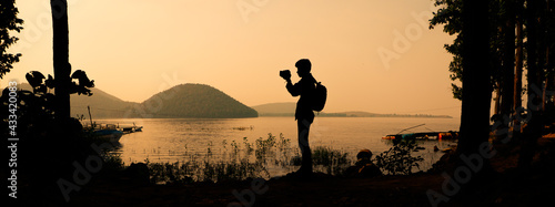 Photography Silhouette of a lone photographer in nature