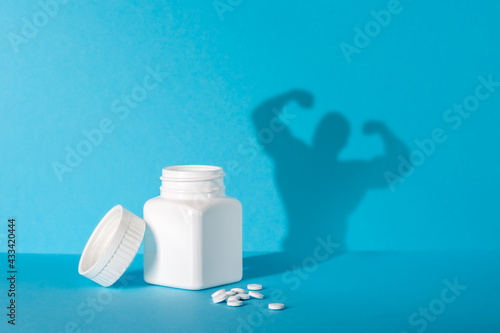 barattolo di pastiglie con ombra, integratore alimentare - vitamine photo