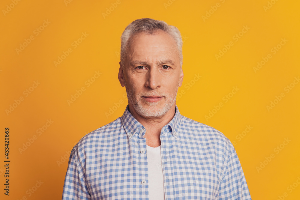 Portrait of pensive serious with white bristle old man isolated on yellow background Portrait of pensive serious with white bristle old man isolated on yellow background