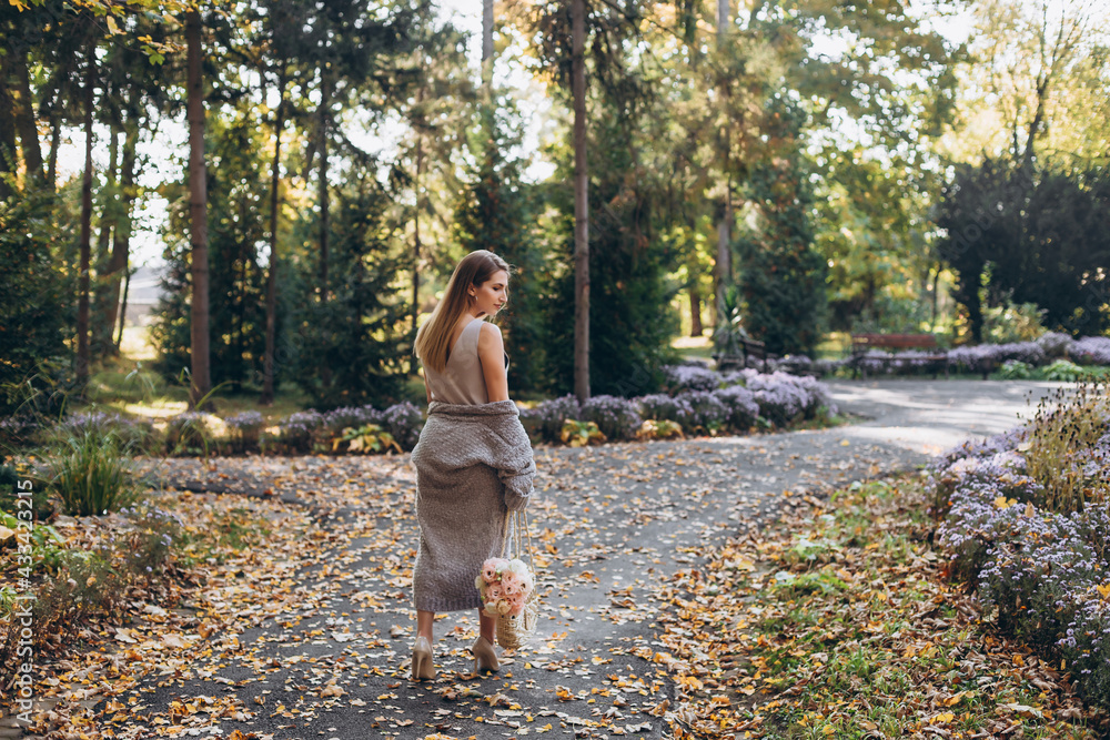 Happy pregnant woman enjoying nature. Walking on the park. Happy pregnant woman enjoying nature. Walking on the park.