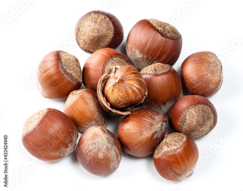 pile of shelled and unshelled hazelnuts closeup