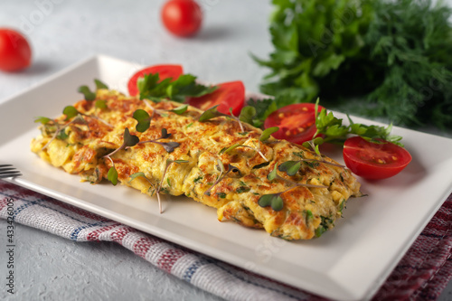 Slika na platnu Fresh French omelet with fresh vegetables. Vegetarian food