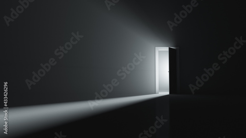 A slightly open door to a room with bright light. Copy space.