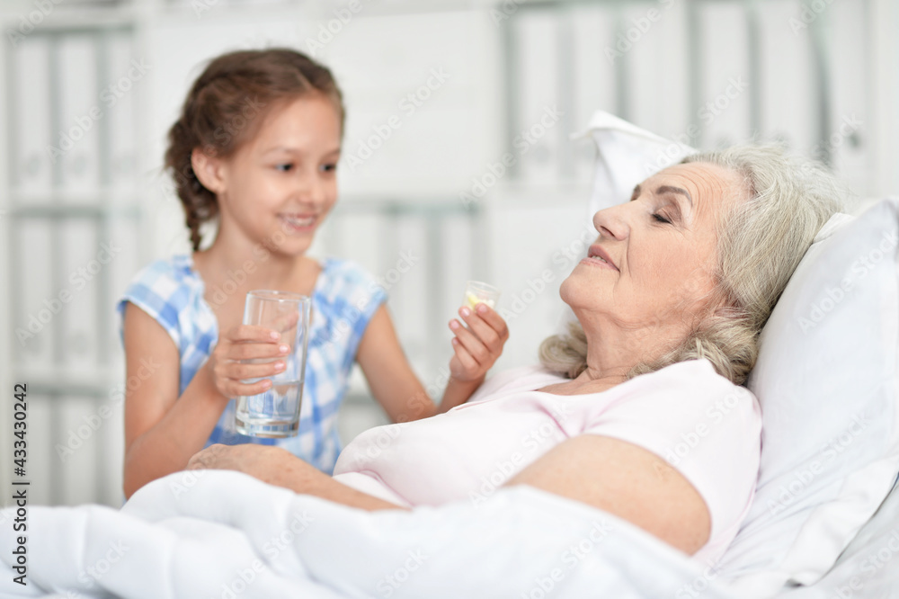 Granddaughter with grandmother sitting at home Granddaughter with grandmother sitting at home