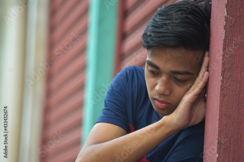 A Sad Young Filipino Teen Boy