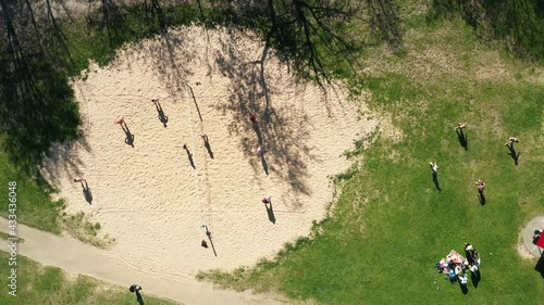 View from the height of the beach and people playing volleyball in Drozdy in Minsk.Belarus photo