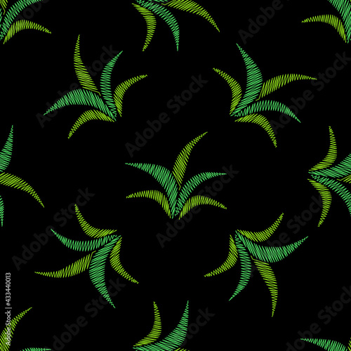 Green leaf embroidery stitches imitation on black background © ellinanova