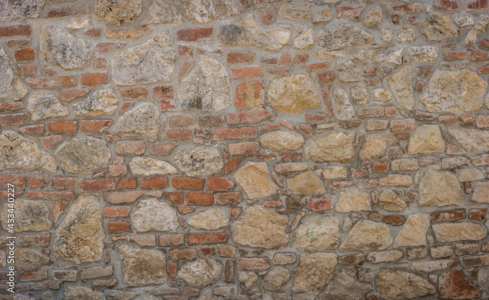 Fototapeta premium Restored old brick and limestone wall