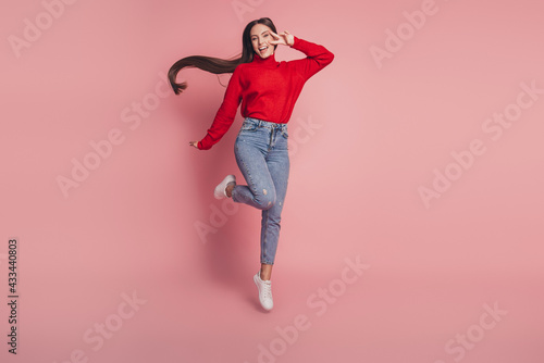 Full size photo of jumping high lady v-signing positively wear casual clothes