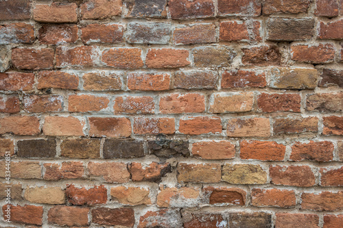 Old brick wall grouted with lime mortar