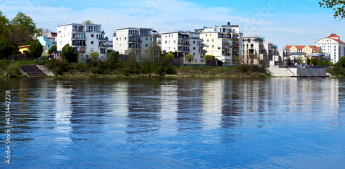 View over the river Elbe in Magdeburg with modern residential buildings on the bank of the blue river in the east of Germany