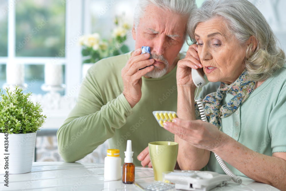 ill Senior couple with pills at home ill Senior couple with pills at home