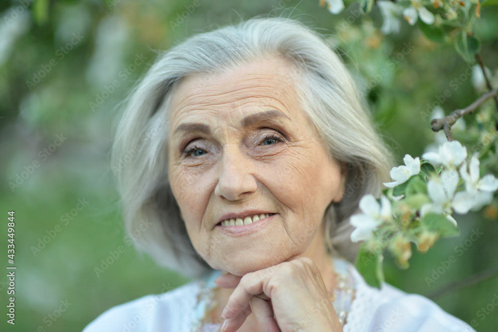 happy senior beautiful woman in spring park happy senior beautiful woman in spring park