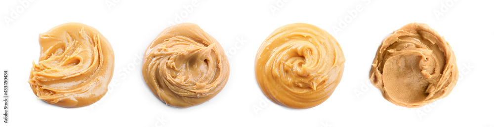 Fototapeta premium Set with delicious peanut butter on white background, top view. Banner design