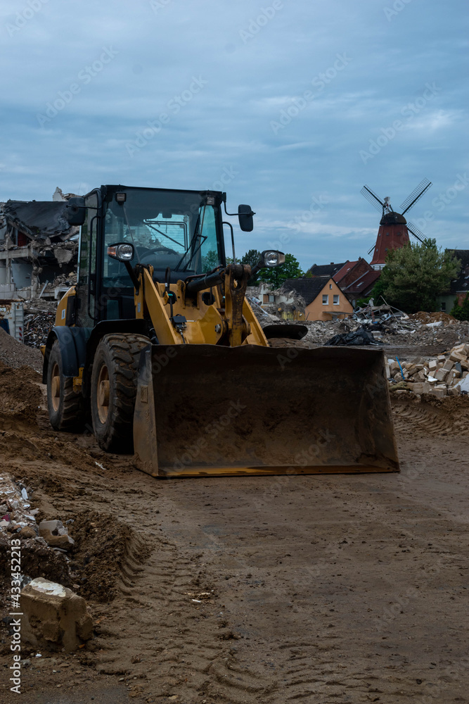 Fototapeta premium yellow construction machines during work much rolled and stones. bulldozer