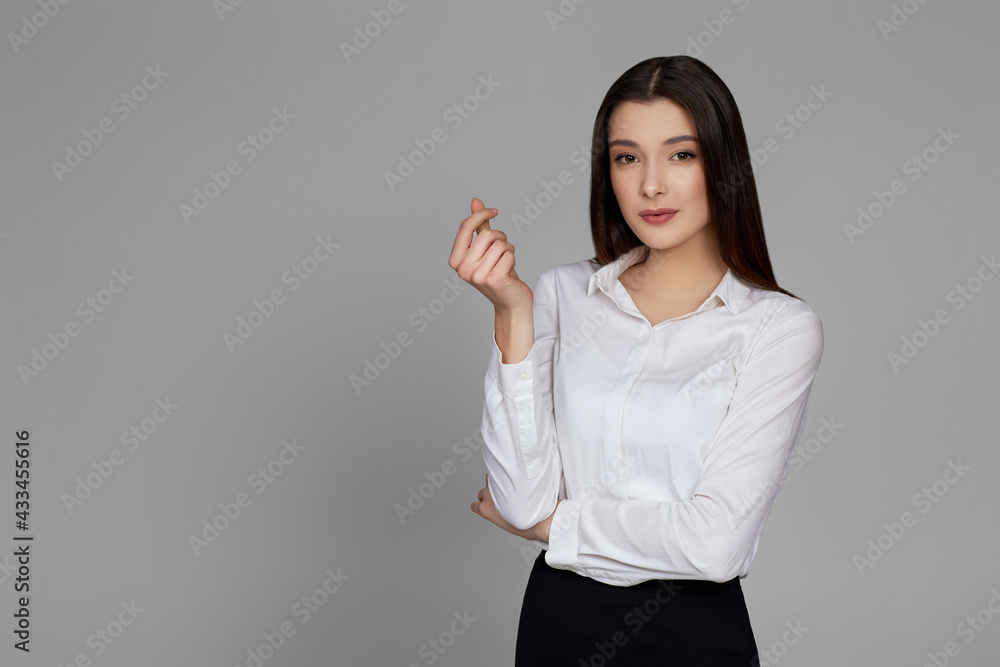 beautiful business woman in white shirt showing love gesture beautiful business woman in white shirt showing love gesture