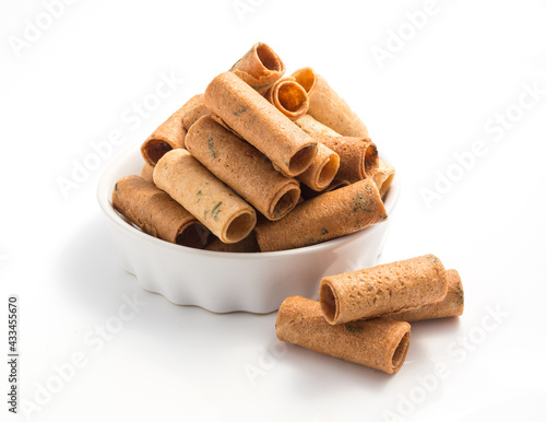 Tongmuan, Thai's snacks in a small bamboo basket, white background photo