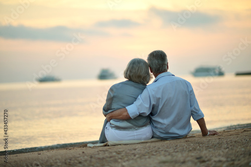 Mature couple relaxing on beach