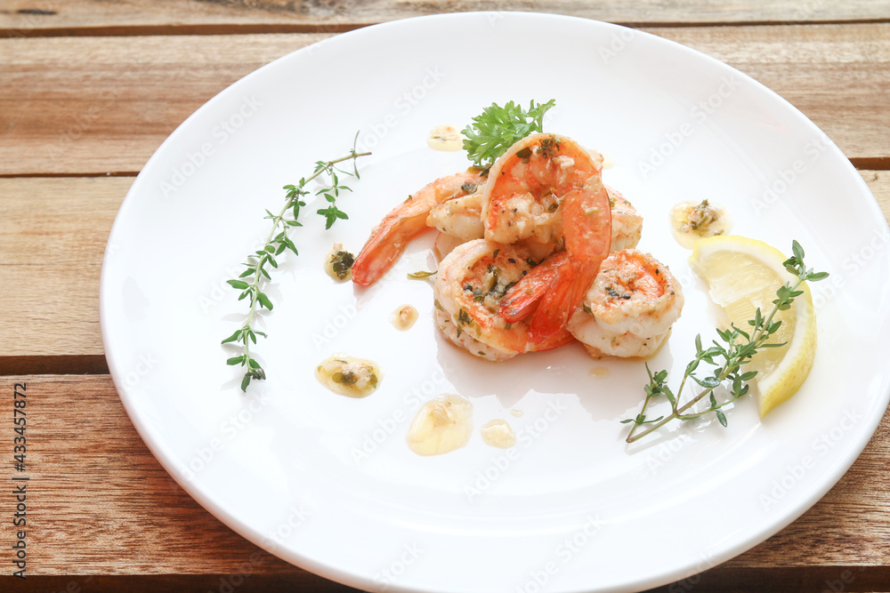 Lemon butter herb shrimps on plate Lemon butter herb shrimps on plate