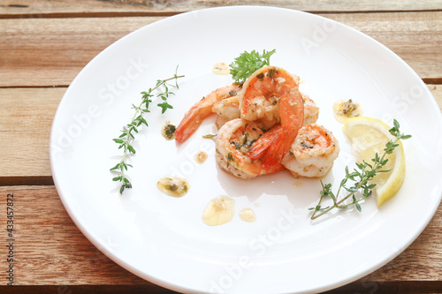 Lemon butter herb shrimps on plate