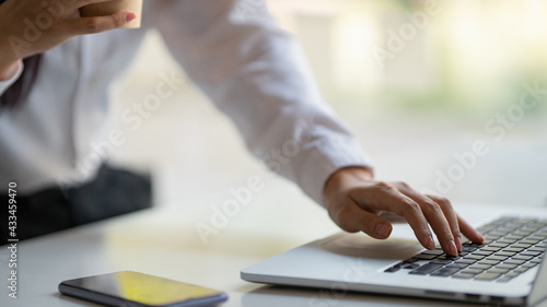 Closeup image of a businesswoman s hands working.