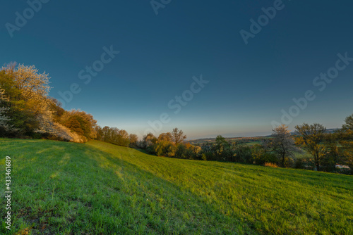 Meadows over Vizovice town with sunrise and fresh color air in east Moravia