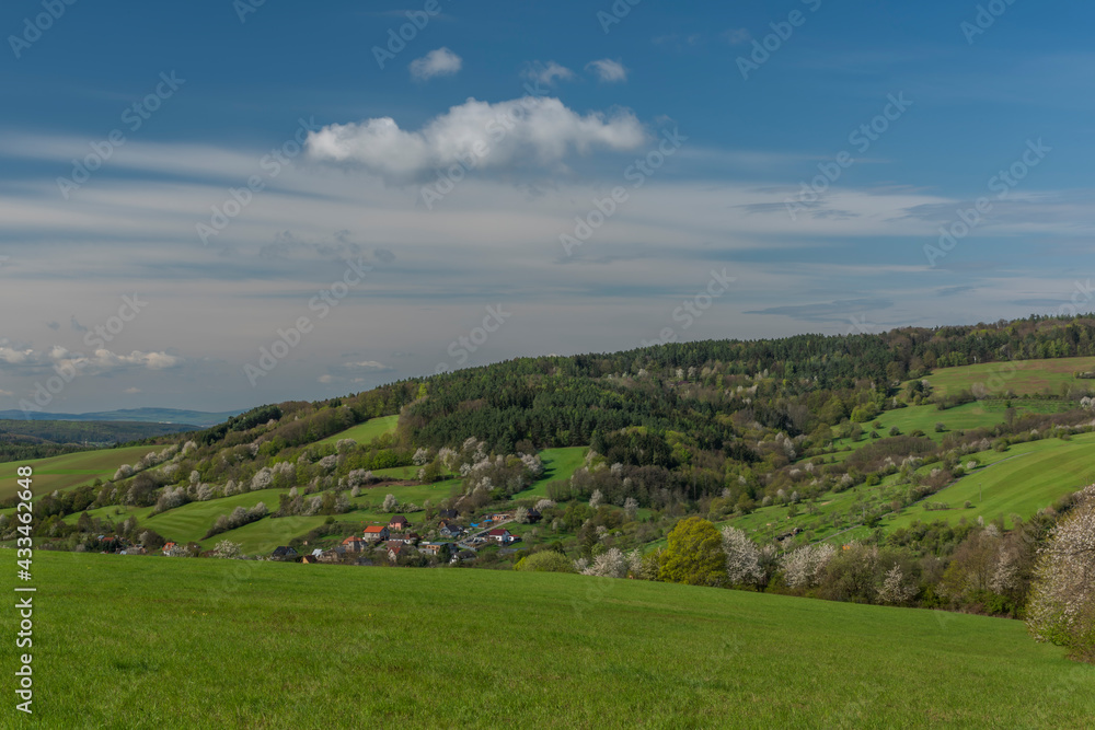 Obraz premium Meadows over Horni Lhota village in spring sunny fresh morning