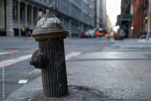 Fototapeta Naklejka Na Ścianę i Meble -  Old Fire Hydrant along a Sidewalk in Midtown Manhattan of New York City