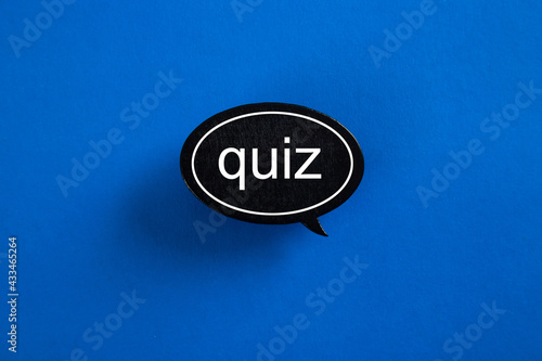 QUIZ with speech bubbles on blue background