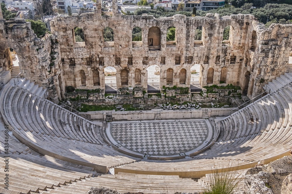 Top view of Greek ruins of Odeon of Herodes Atticus (161AD) - stone Roman theater at the Acropolis hill. Athens, Greece.