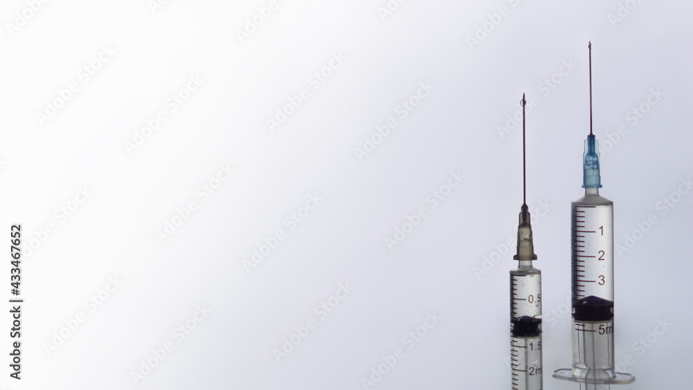 vaccination concept, syringe and glass vial with medicine for injection close-up, copy space vaccination concept, syringe and glass vial with medicine for injection close-up, copy space