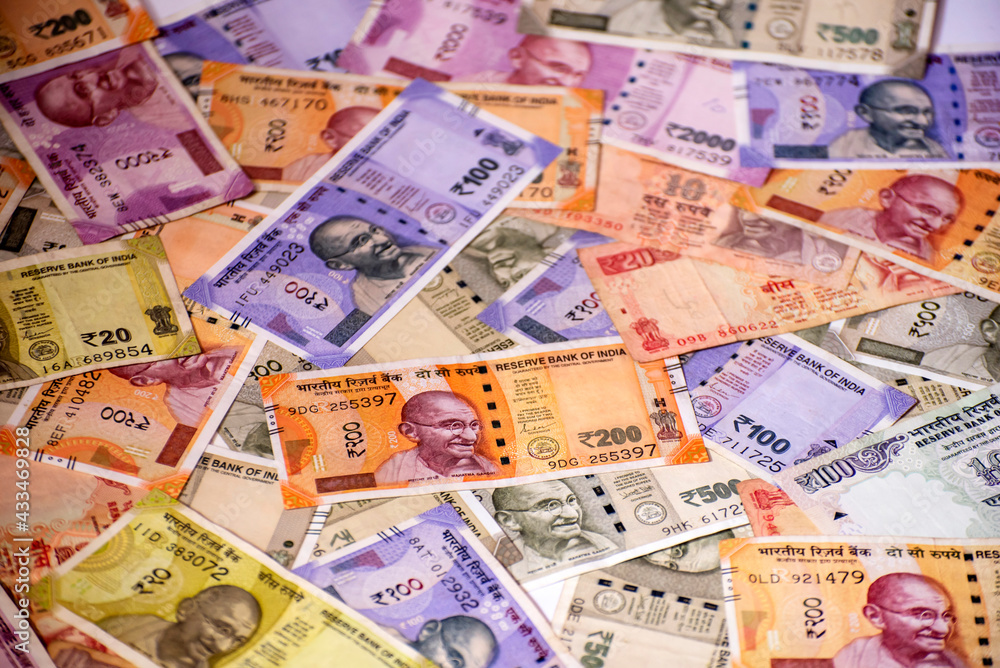 Obraz premium Cash in various Indian Paper Currency (rupees) as a background. Indian banknotes.